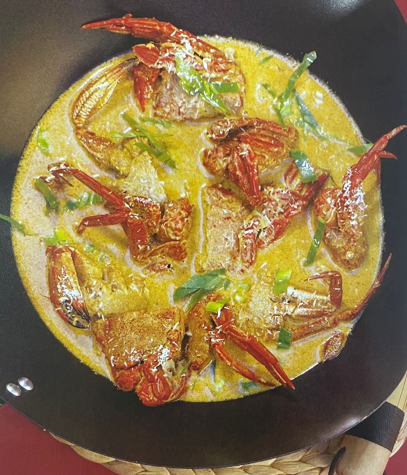 Cangrejos con salsa de curry y cilantro